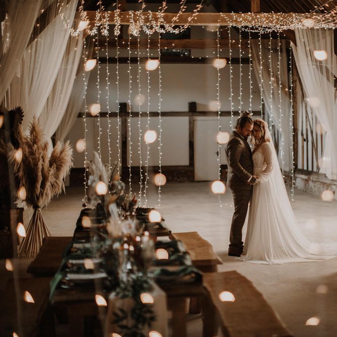 Boho luxe wedding day photography in country barn with fairy lights 