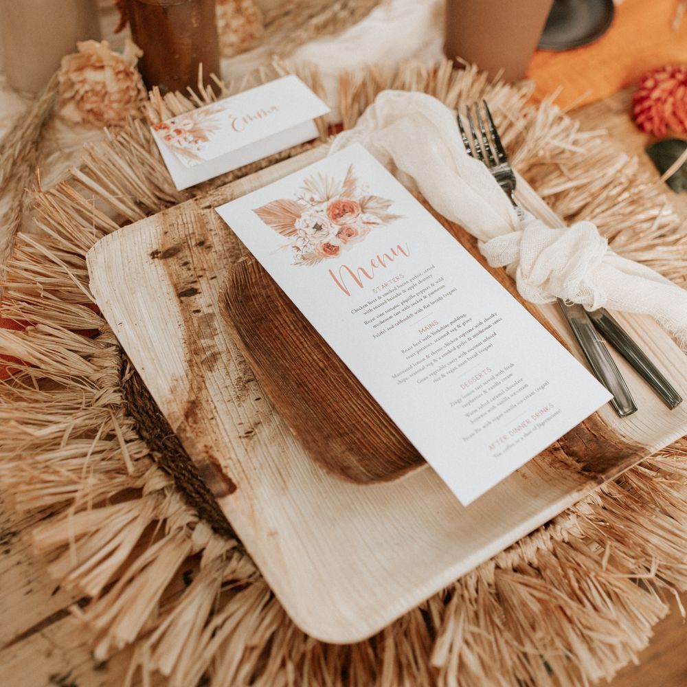 Table decoration with wooden plates and stationery 