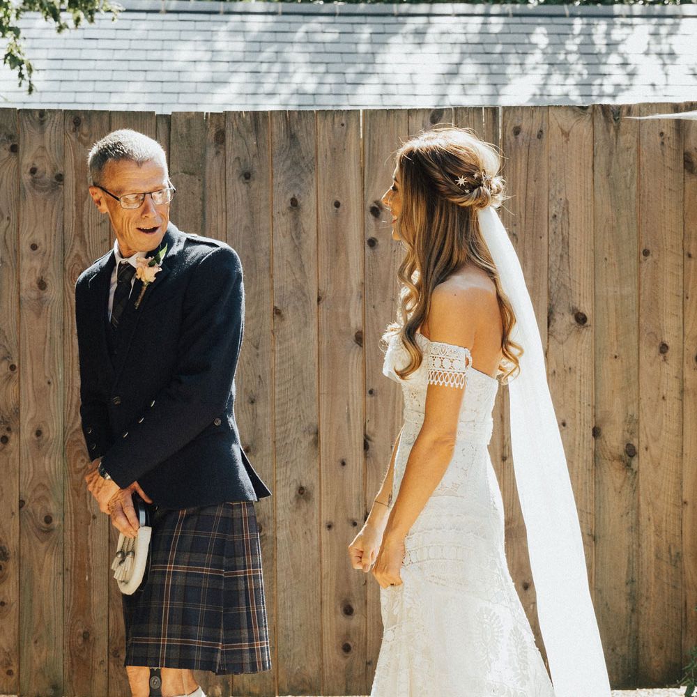 Father-of-the-bride in kilt sees bride in Rue De Seine wedding dress for the first time
