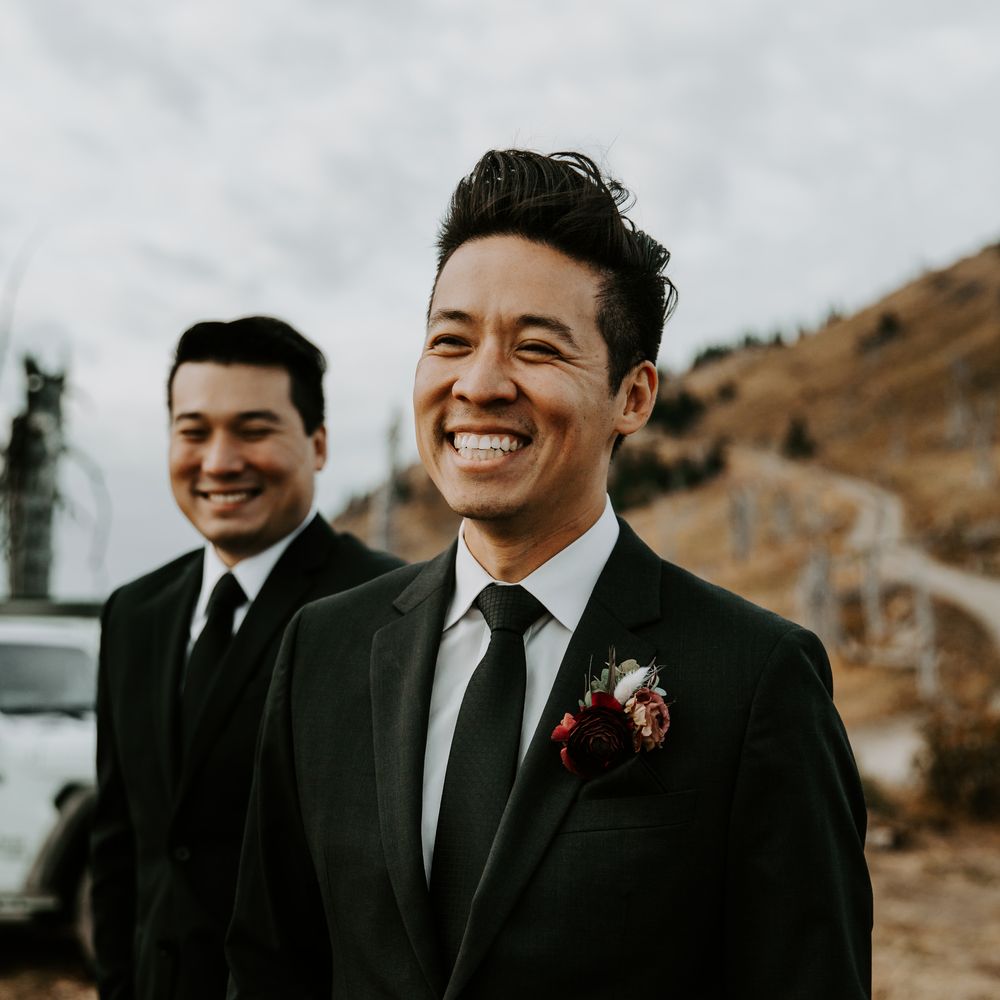 Groom smiles before wedding ceremony