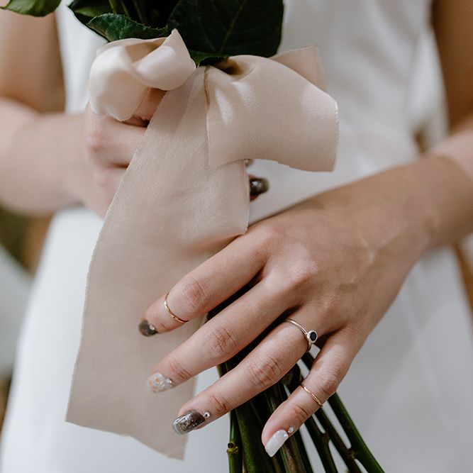 Stylish nail art and wedding rings 