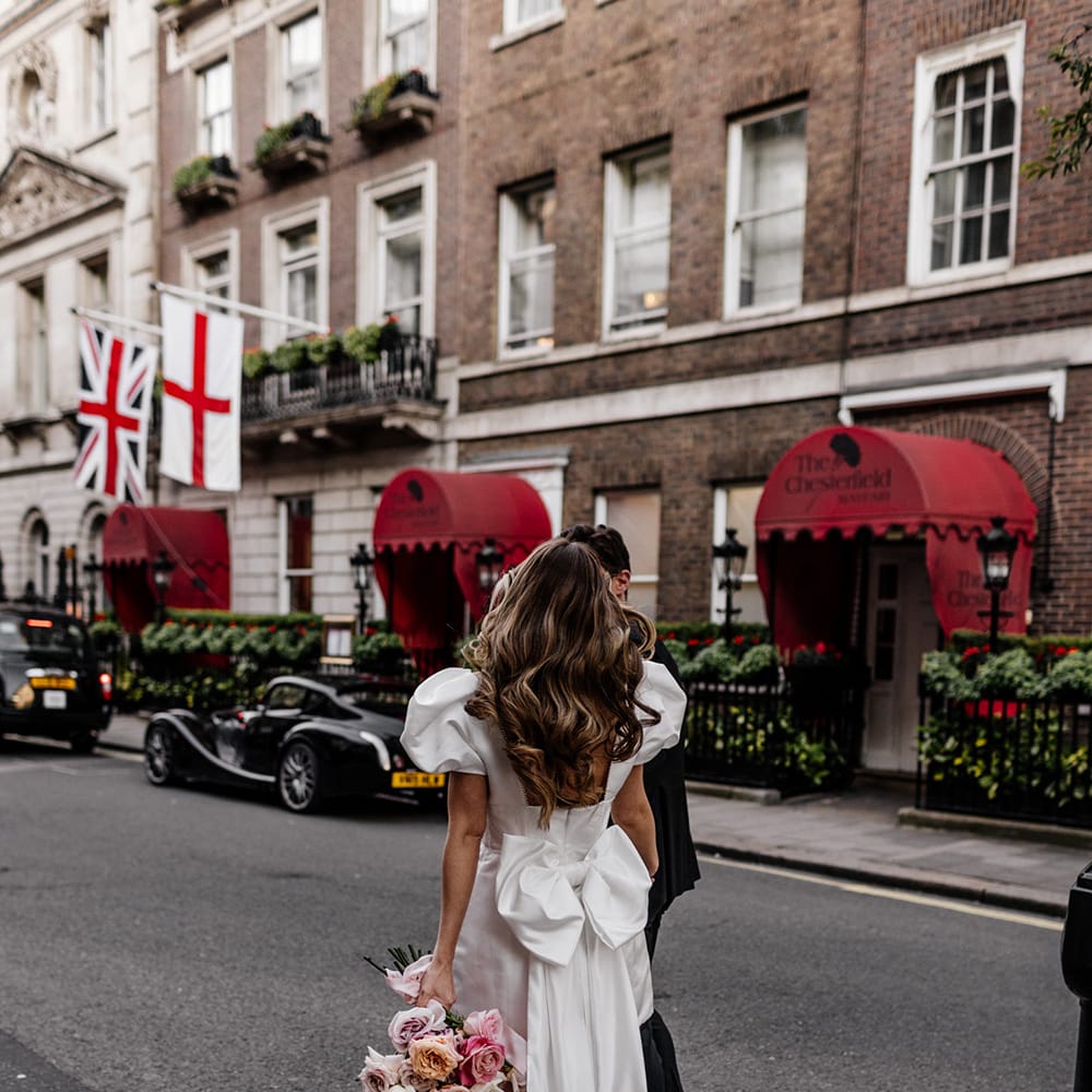 Giant bow wedding dress detail on short wedding dress for stylish city wedding 