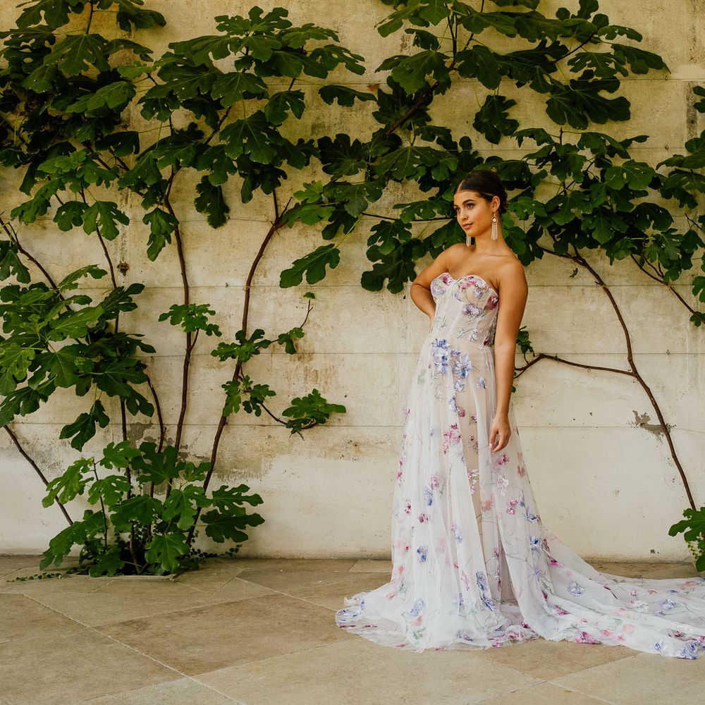 Bride in a hand painted wedding dress by Savin London via Lace & Co Bridal for a fiesta theme wedding 