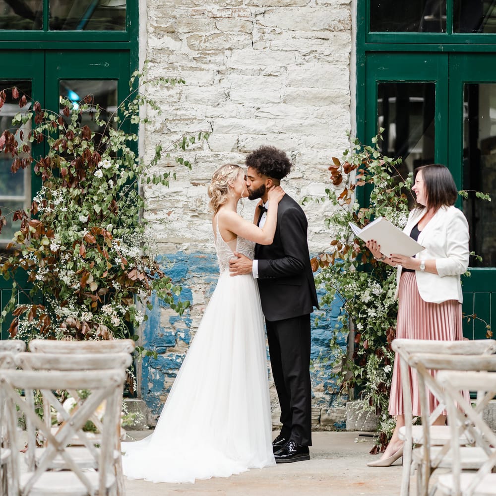 Bride and groom kissing at the celebrant lead ceremony at Torr Vale Mill in Derbyshire 