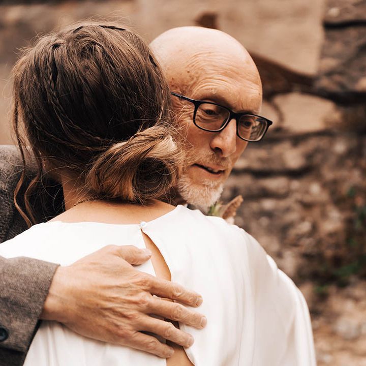 Bride hugs her father on her wedding day