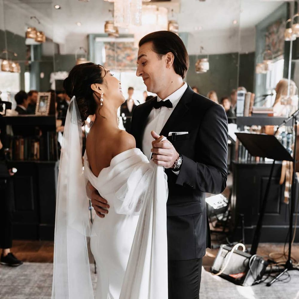 Bride and Groom dance with a lovely monotone contrast