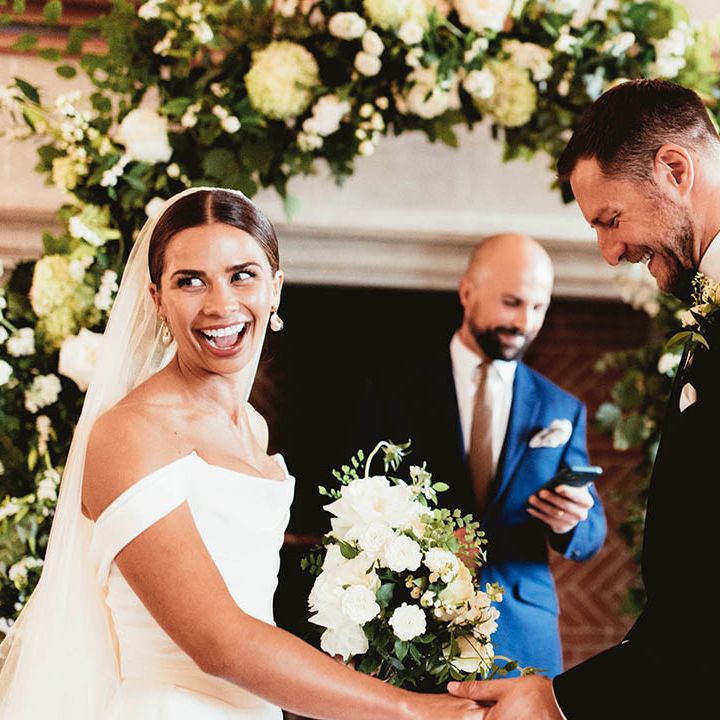 Bride & groom stand together during their wedding ceremony