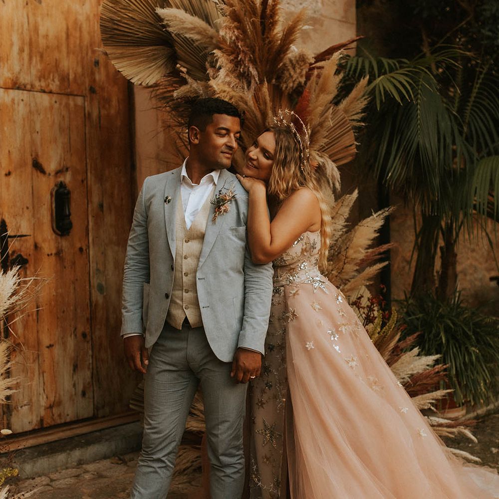 Bride leans in to groom on her wedding day