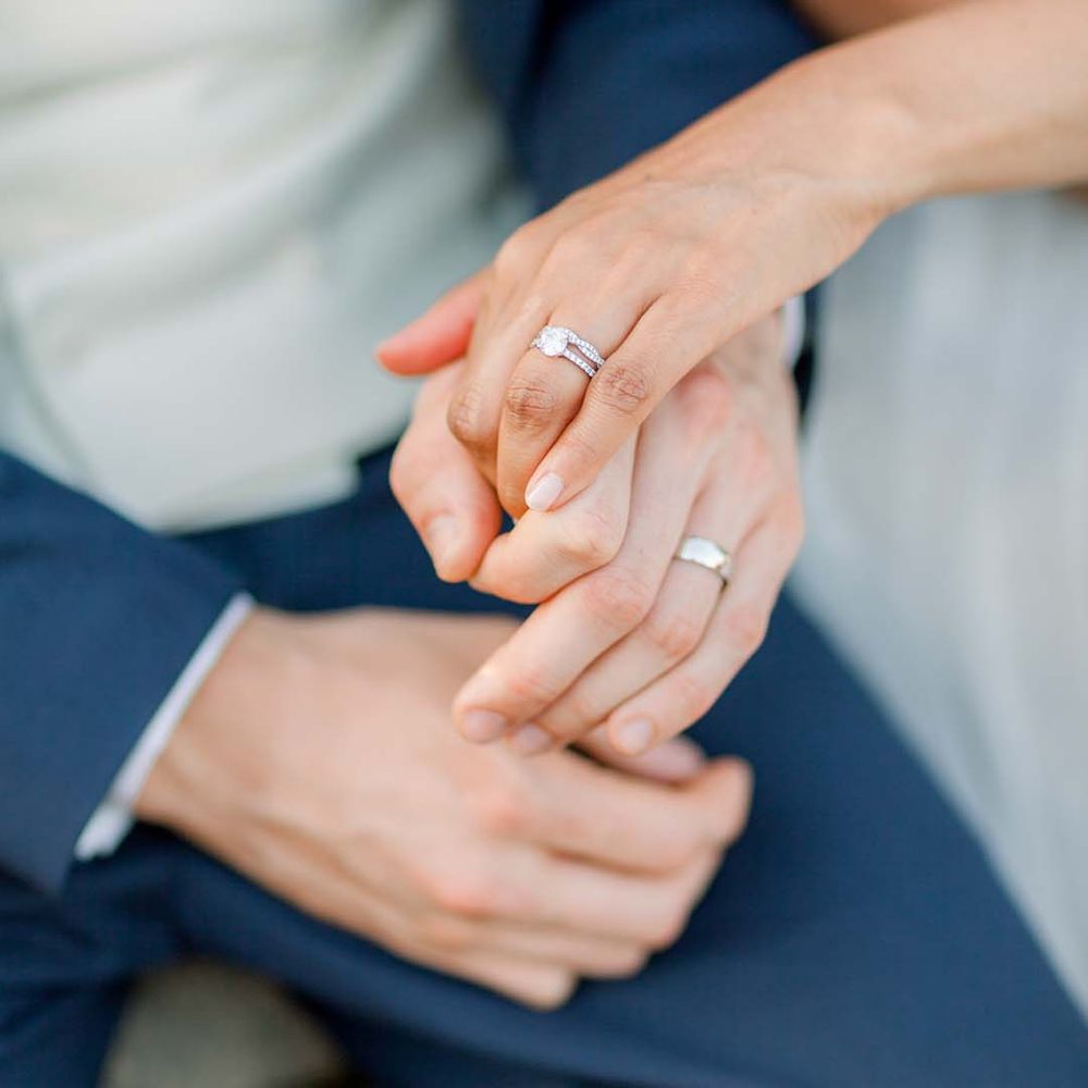 Bride & groom hold hands on their wedding day