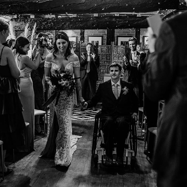 Bride and groom go back down the aisle as a married couple 