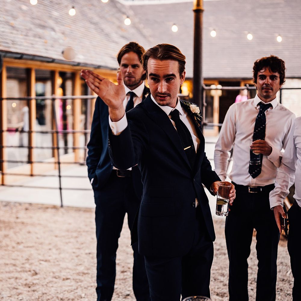 The groom gets involved in a game of Prosecco pong 