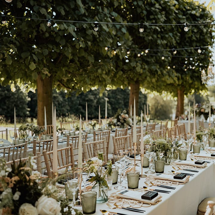 Outdoor summer wedding tablescape with white and green wedding table decorations 