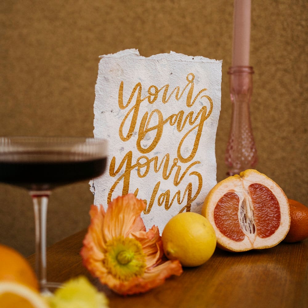 Gold calligraphy hand painted stationery reading 'your day your way'