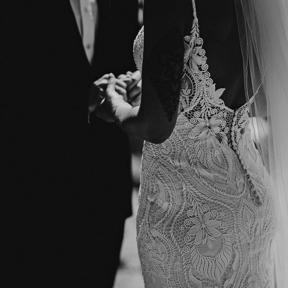 Scoop back lace wedding dress with button detail