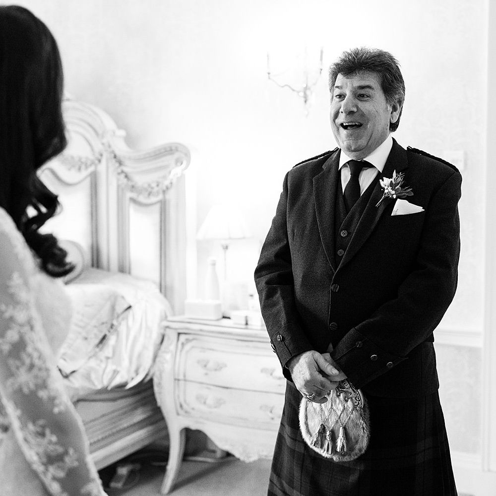 Father of the bride sees his daughter for the first time on the morning of her wedding day