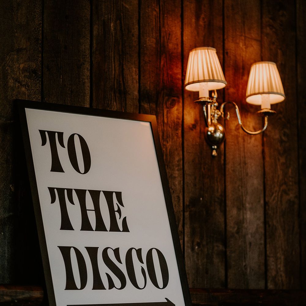 Black and white wedding disco sign for the festival theme 