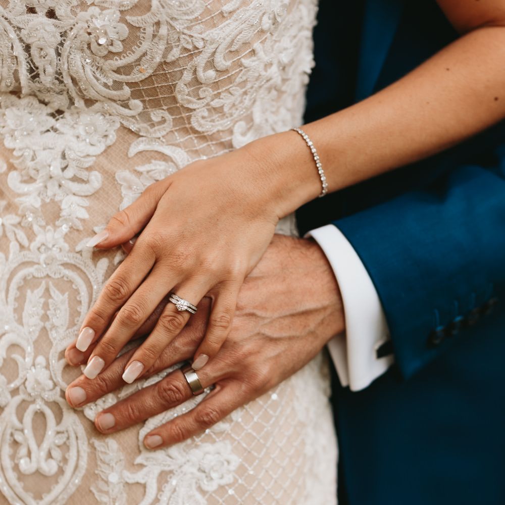 Bride and groom wedding and engagement rings by All Diamonds