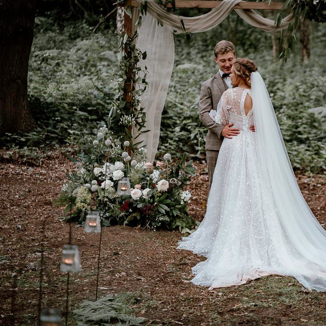 Bride in bespoke wedding dress at woodland wedding in Sherwood Glade