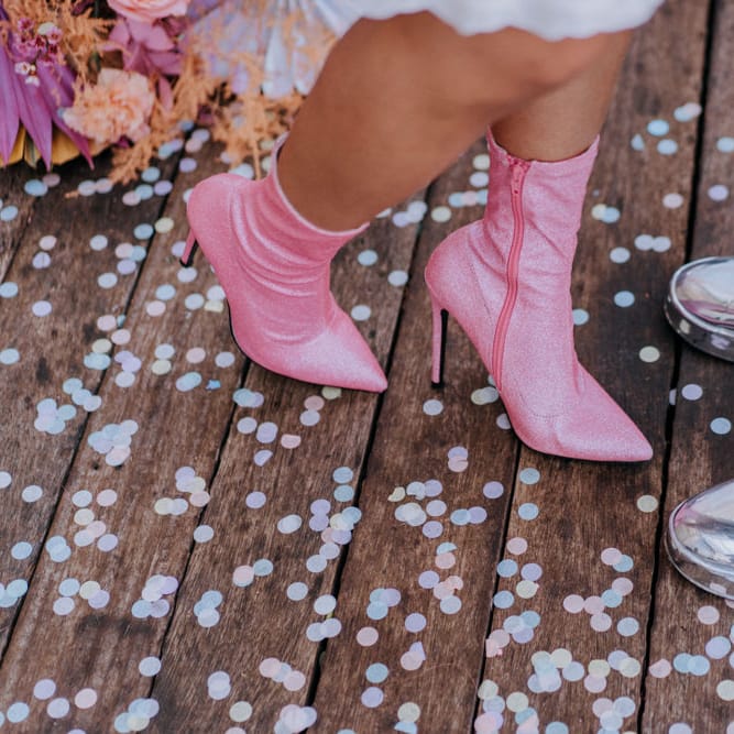 Pink bridal boots and shiny silver trainers 