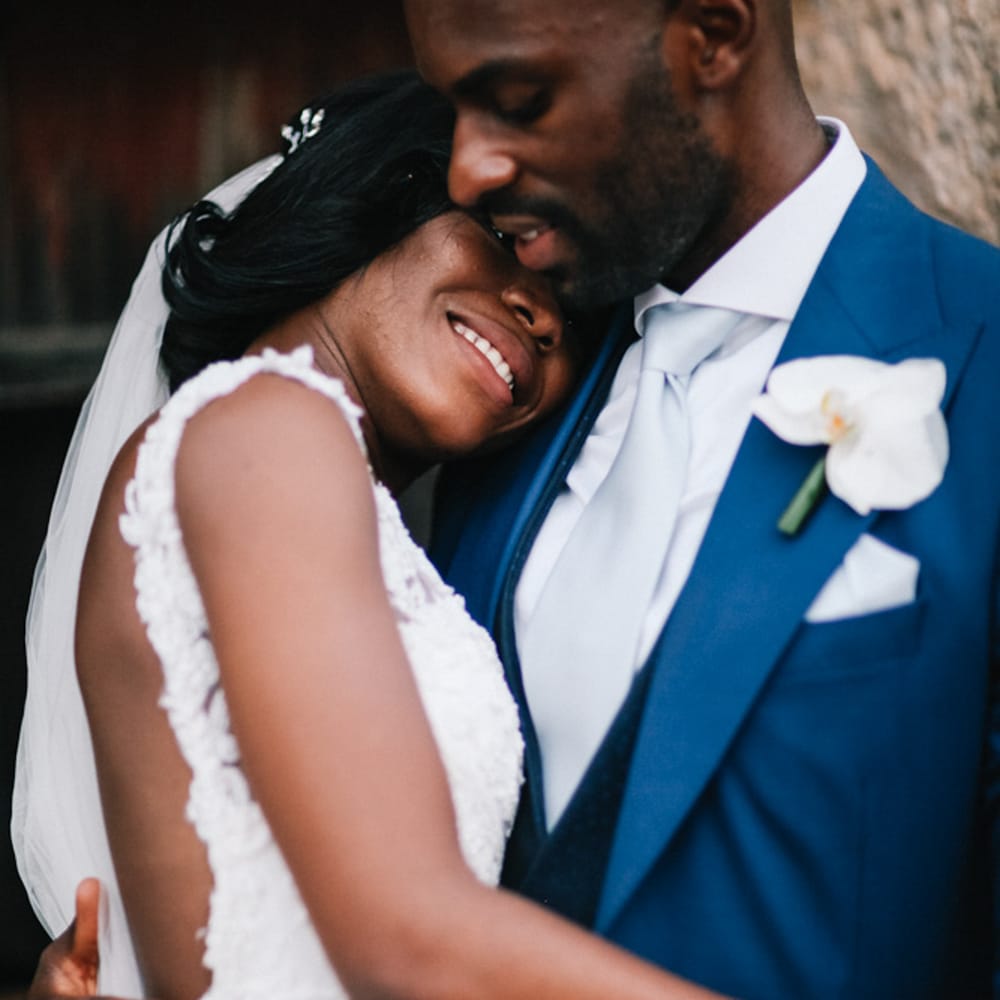 Bride and groom holding each other