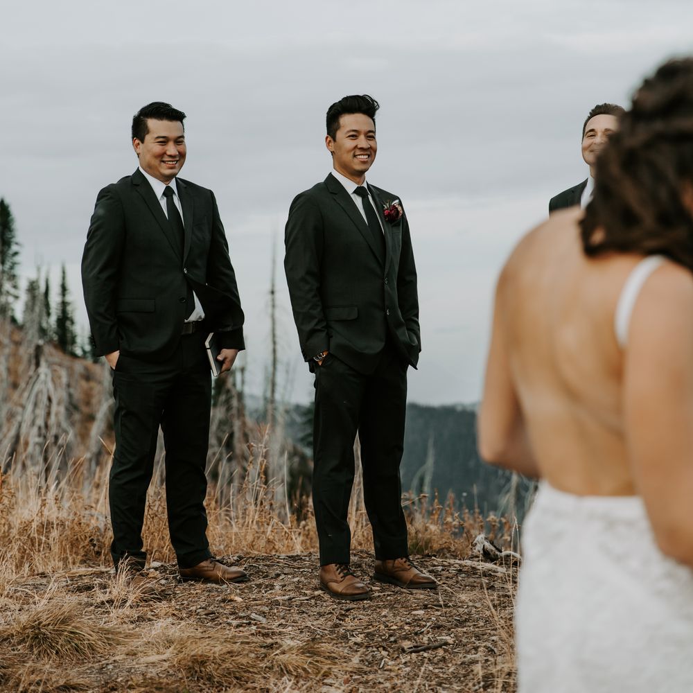 Groom smiles during wedding ceremony