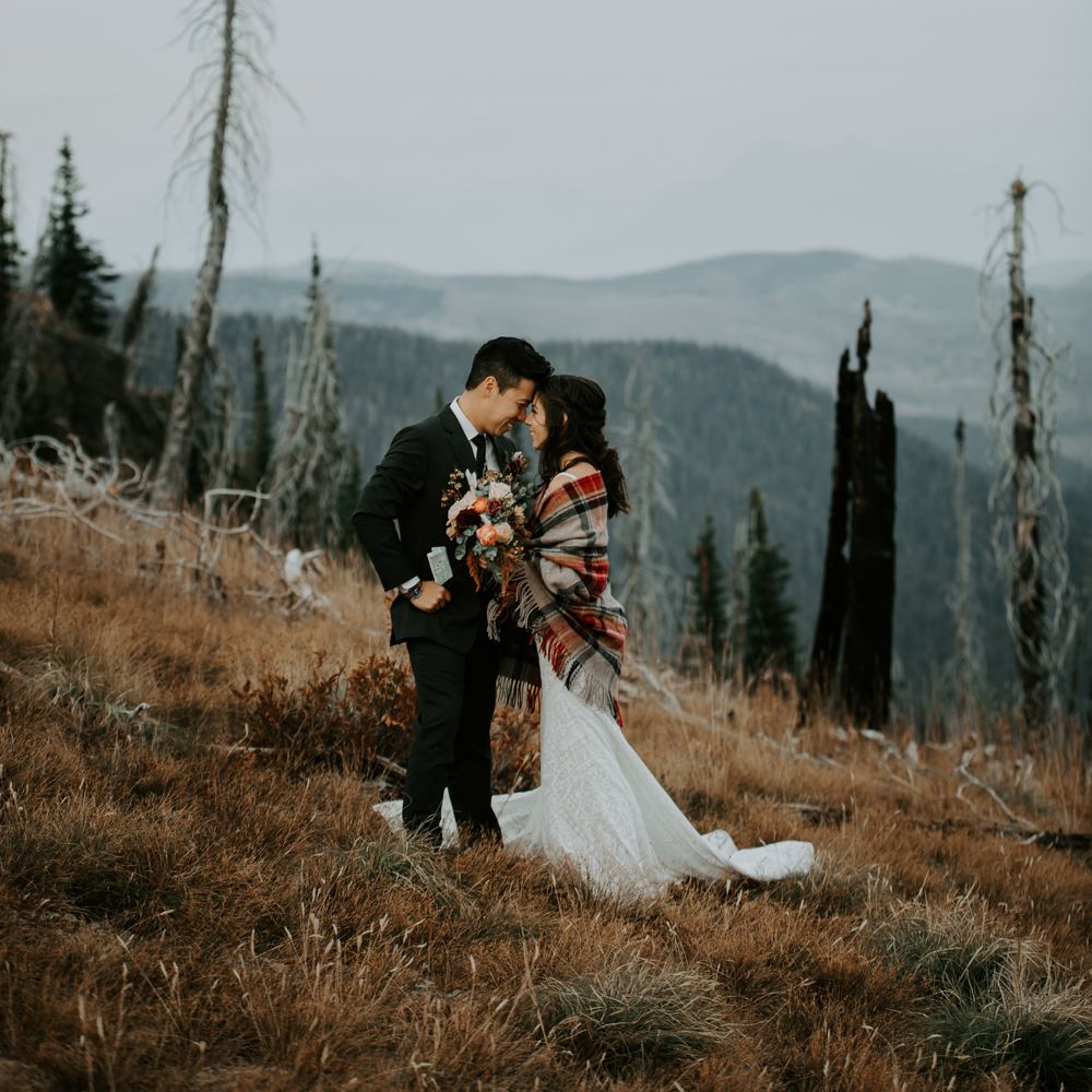 Bride & groom look at one another lovingly 