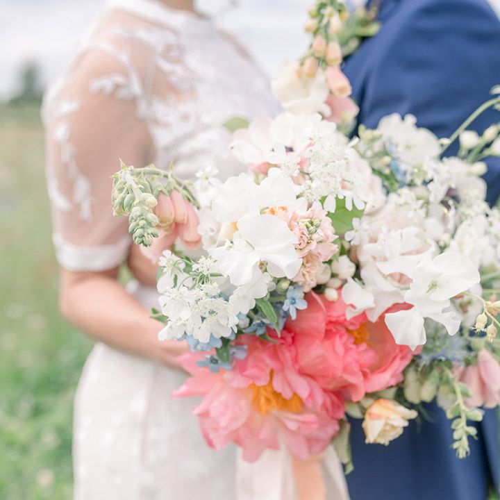 Pastel coloured wedding bouquet with peonies, stocks and orchids