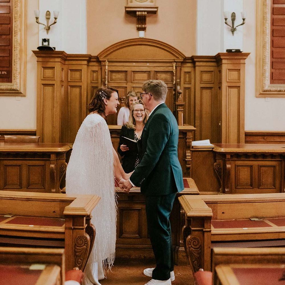 Bride & groom stand at the altar on their wedding day during civil ceremony in Brighton