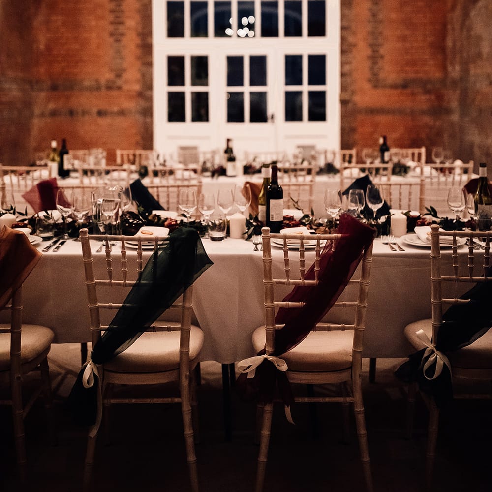 Long tables at Minley Manor with ribbons on chair for detail