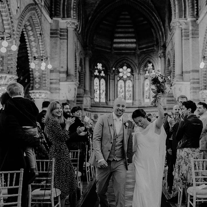 Bride & groom celebrate as they walk down the aisle | Irene Yap Photography