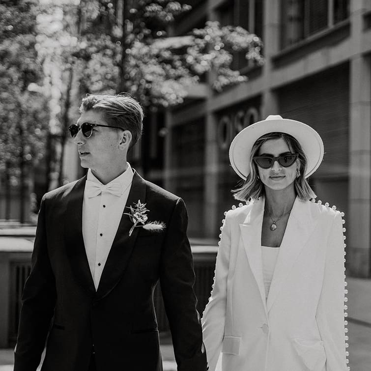 Bride and groom look cool in sunglasses for town hall wedding 