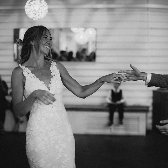 Bride & groom have their first dance in black & white image on their wedding day