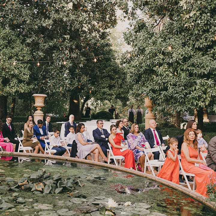 wedding guests at outdoor wedding ceremony in Spain