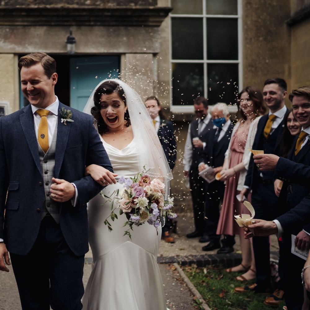 Bride & groom leave chapel 