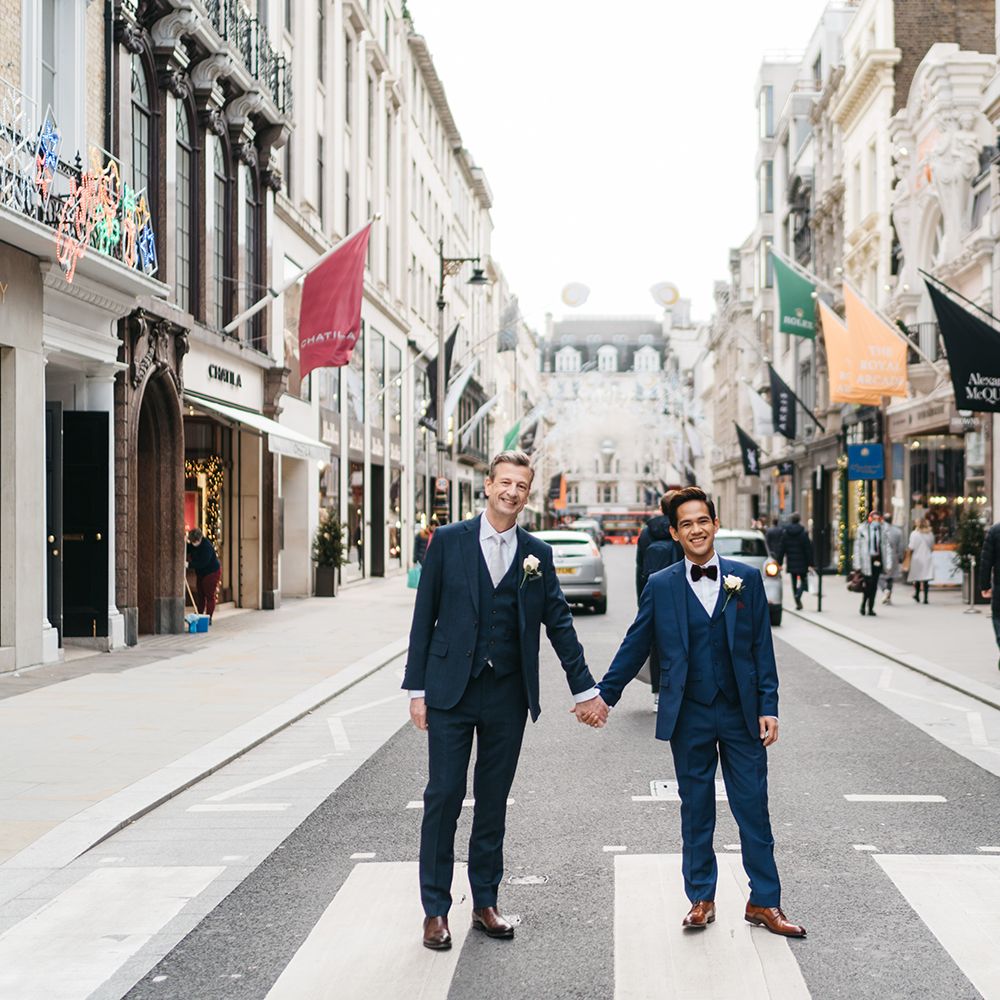 Grooms stand in the street of London