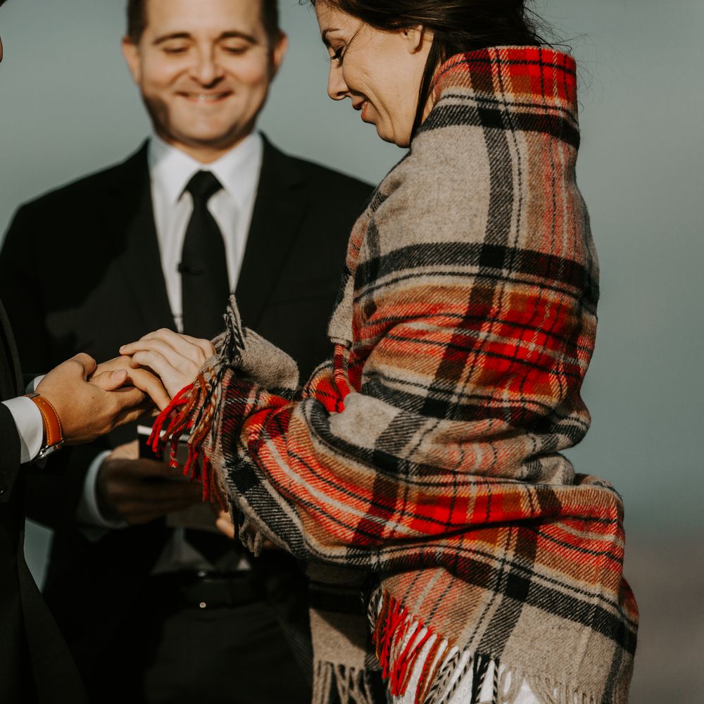 Bride & groom exchange rings during wedding ceremony