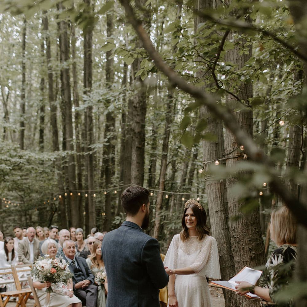 Bride looks at her groom lovingly on her wedding day during ceremony