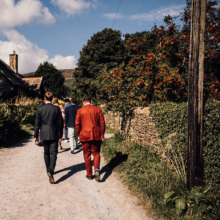 Wedding guests walk to ceremony