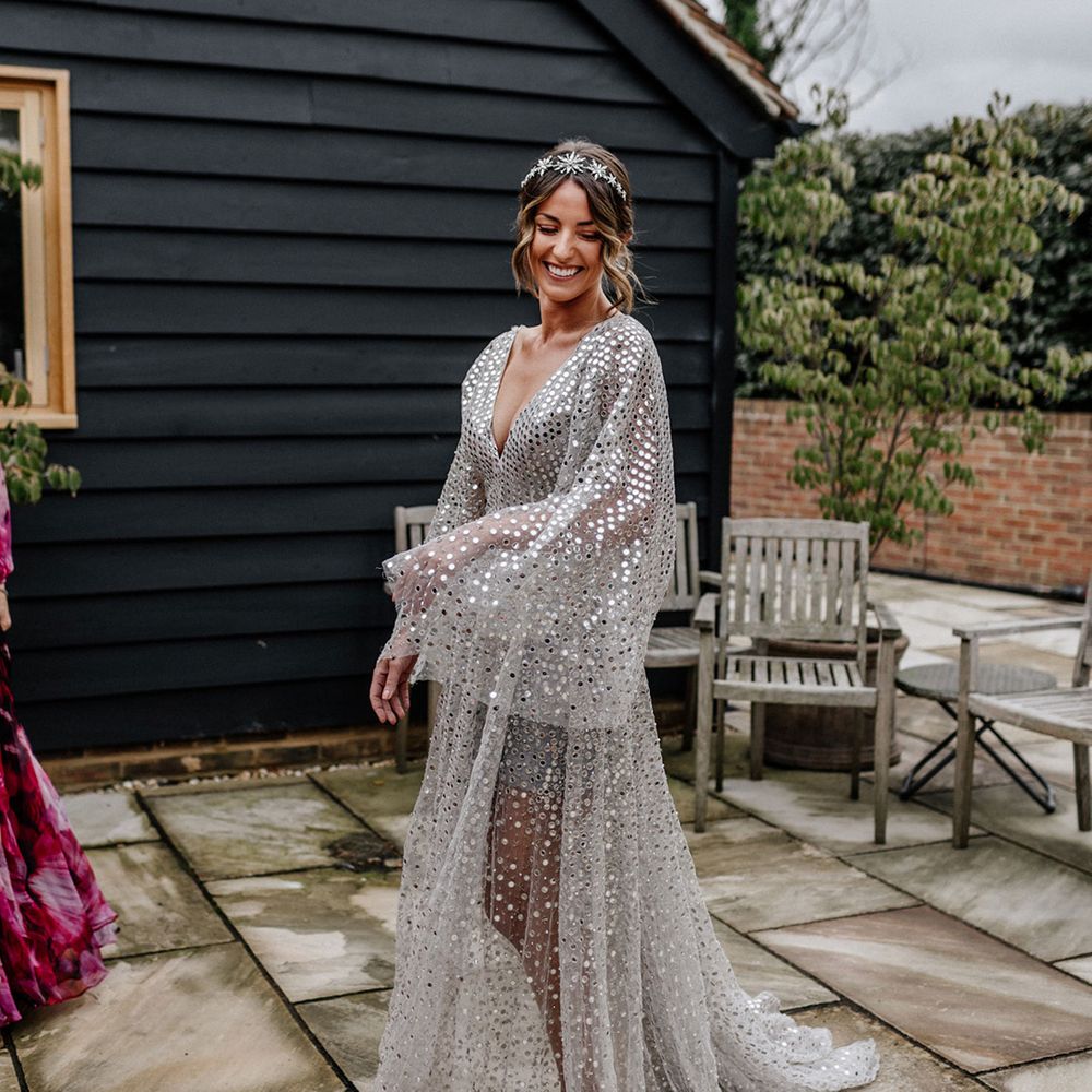 Stylish bride in a Tilly Thomas Lux bridal crown and silver sequin wedding dress 