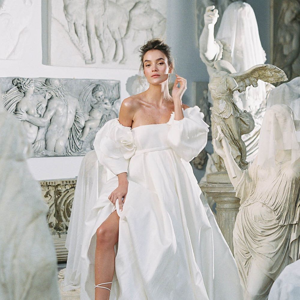 Bride in puff sleeve wedding dress with double strap sandal stilettos that lace up