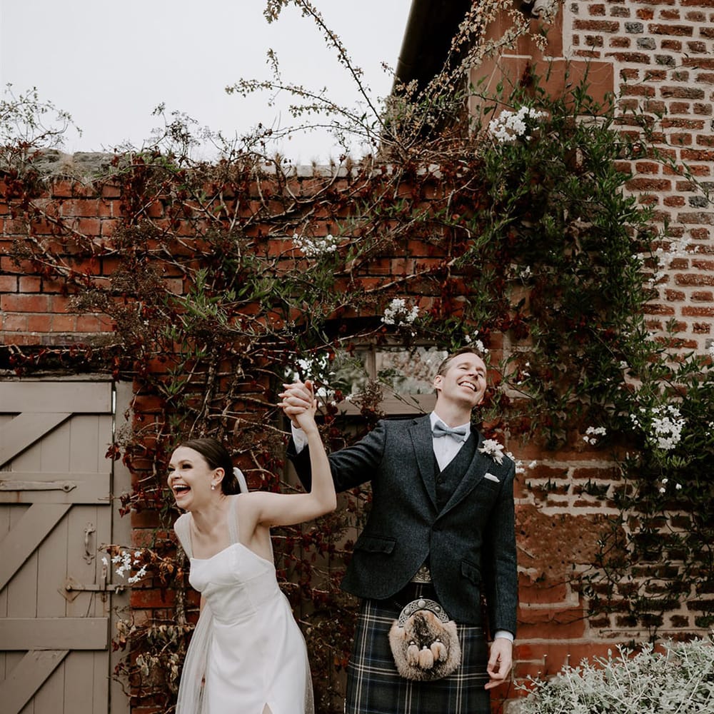 The bride and groom celebrate together after getting married 