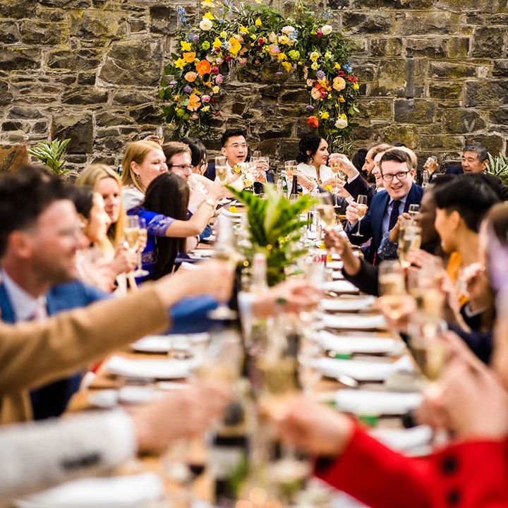 Wedding guests sit at banquet table at Pias Dinam wedding venue during reception with Chinese Tea Ceremony