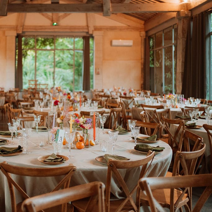 Wedding reception at Domaine de Blanche Fleur with citrus fruit decor and taper candles 