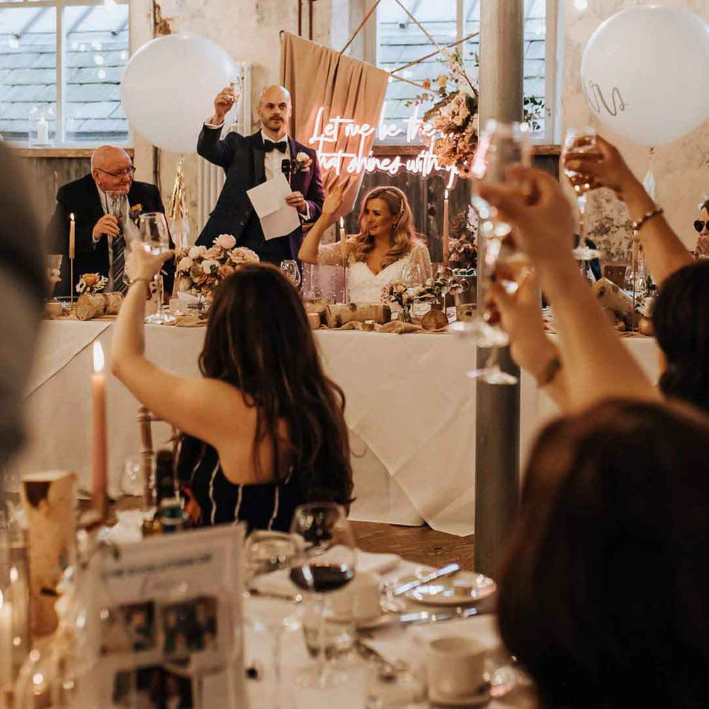 Guests doing champagne cheers at Holmes Mill wedding - how to say no to kids at wedding 