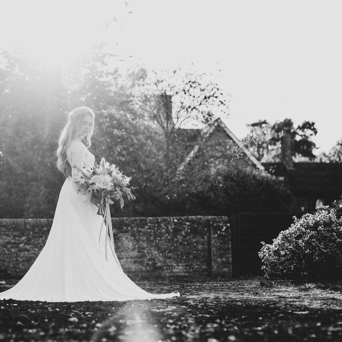 Black and white wedding wedding photography of bride holding her bouquet 