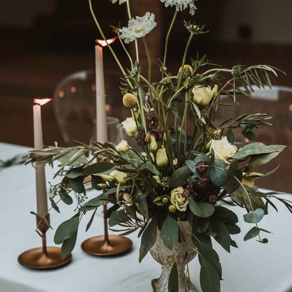 Loose wedding flower arrangement with white flowers and yellow Billy Buttons 