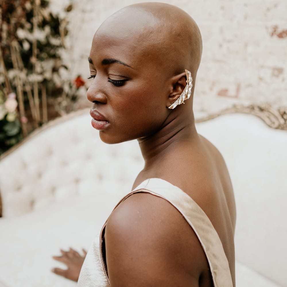 Black bride with alopecia wearing a statement cuff earring 