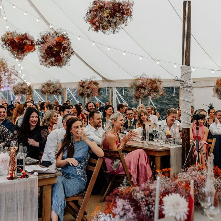 At home marquee wedding reception with pink gypsophila flower clouds 