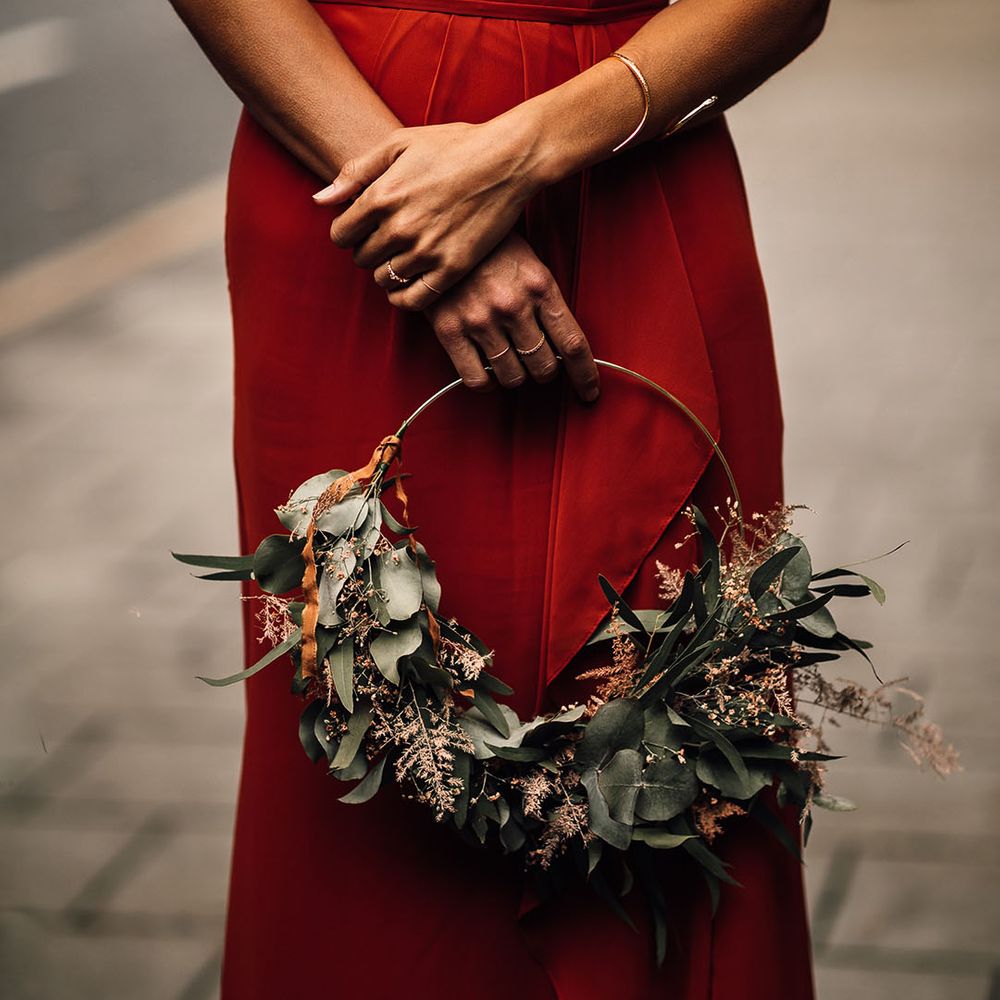 Burnt orange bridesmaid dress and foliage hoop bouquet 