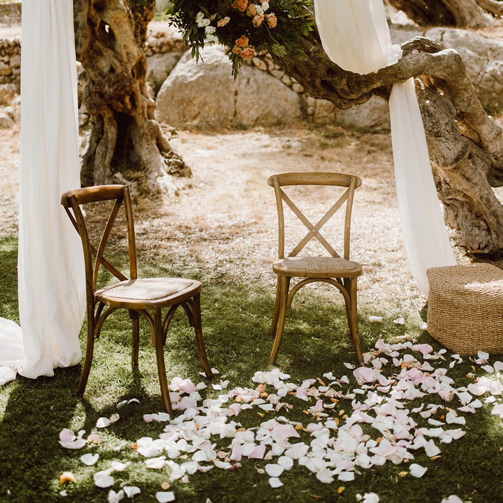 Wooden chairs waiting for the bride and groom 